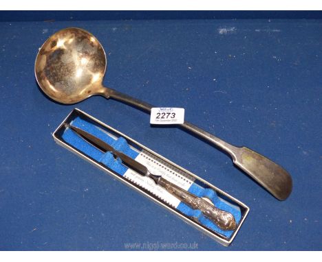 A stainless steel Sterling silver boxed paper knife together with a large plated ladle.