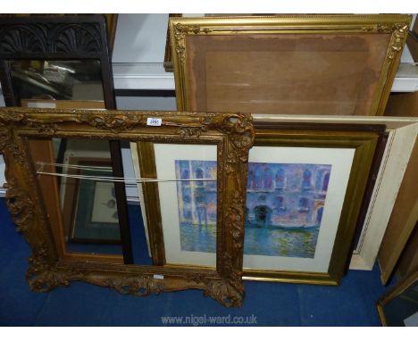 A Monet print, 4 picture frames and a mirror.