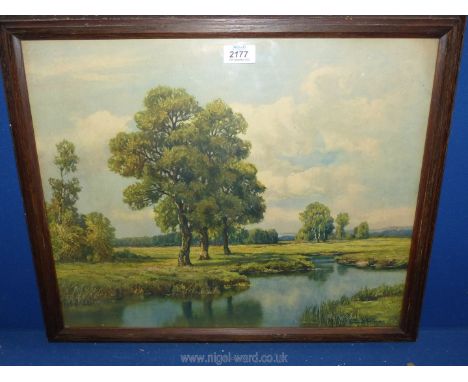 A wooden framed print depicting a river scene with fields, trees and rolling hills in the distance, indistinctly signed lower