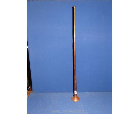 A copper and brass hunting horn.