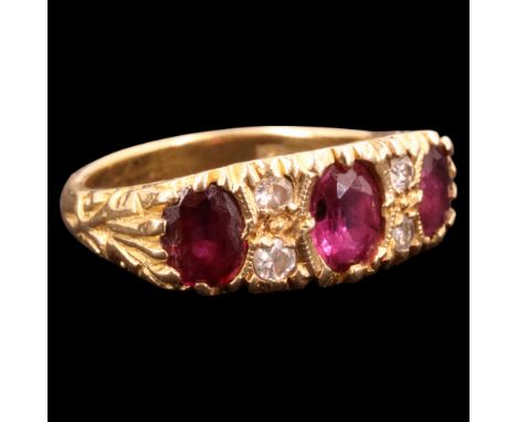 A vintage ruby, diamond and 18 ct gold finger ring, comprising three oval-cut pink stones of approx 1 ct aggregate weight div