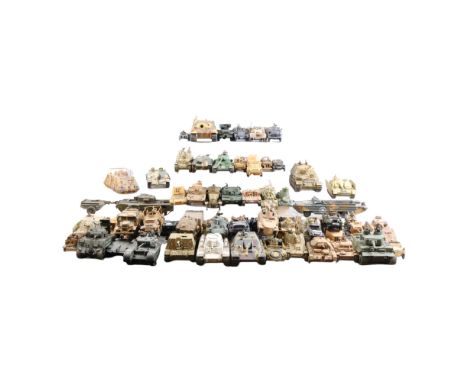 A large collection of plastic-kit-built scale model military vehicles 