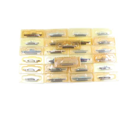 A collection of scale model military battleships etc