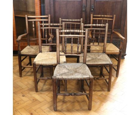 Five late 19th / early 20th Century rush-seated ladder-back kitchen / dining chairs, including an armchair, together with a s