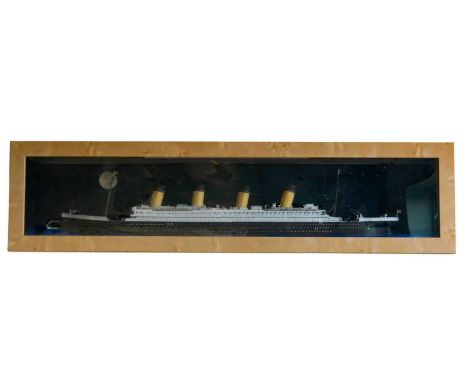 A large printed paper and board scale model of the RMS Titanic, in glazed wooden case, 170 cm x 42 cm x 19 cm