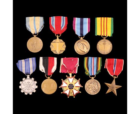  A group of United States Military medals, including The Legion of Merit and Bronze Star