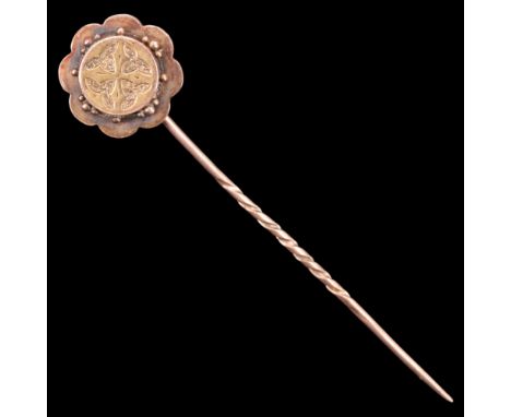 A Victorian 9 ct gold stick pin, having a stylised flowerhead plaque terminal, latter 16 mm, 3.2 g