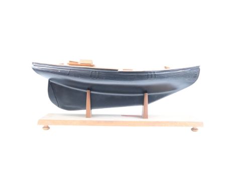 A scale model boat hull, on stand, 81 cm x 30 cm