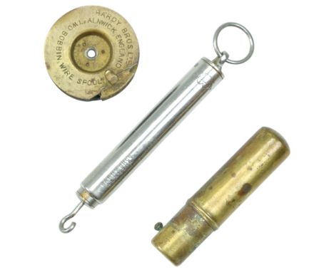 A group of vintage Hardy of Alnwick fishing tackle comprising a "Two Bobbin Wire Spool", a spring balance and a brass oiler