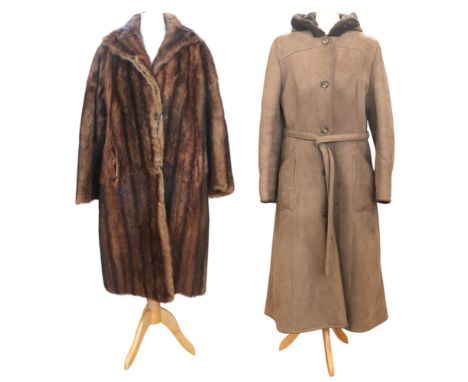 A vintage Morlands hooded sheepskin coat with a suede tie-belt, the label marked "Style 8547", together with a mink fur coat,