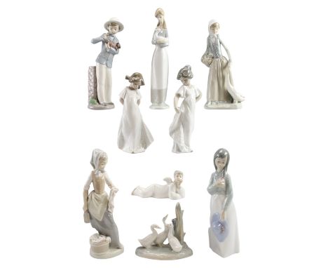 Nine Nao figurines, tallest 28 cm