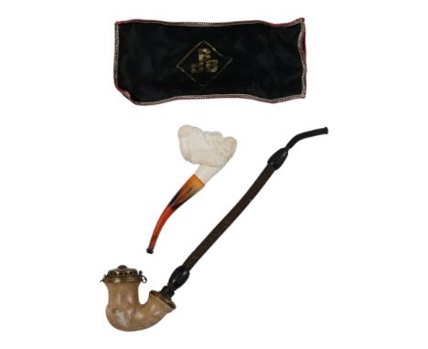 A contemporary meerschaum pipe, its bowl in the form of a bearded bust with turban, together with an early 20th Century Germa