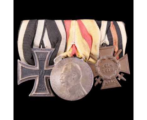 An Imperial German medal group comprising a 1914 Iron Cross 2nd class, Baden Silver Service medal, and Cross of Honour