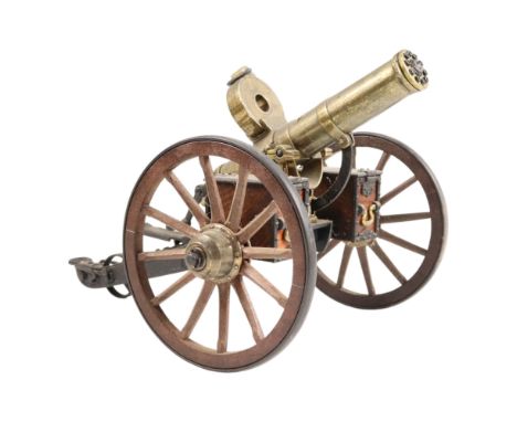 A diecast scale model Gatling gun, barrel length 23 cm