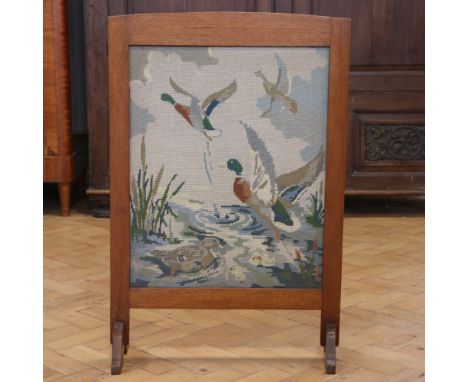 A mahogany fire screen, having an embroidered insert depicting ducks taking to flight, circa 1920s / 1930s, 80 cm x 54 cm 