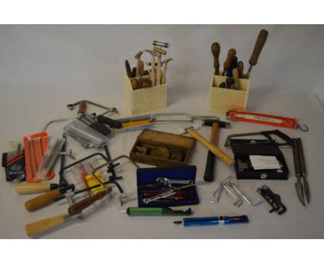 Watchmakers hand tools including small hammers, various size hacksaws, punches etc
