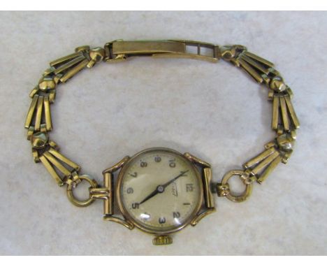 Ladies 9ct gold Tissot watch with 9ct strap complete with box total weight 17.9 g