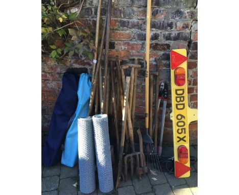 Assorted garden tools, folding chairs, 2 rolls of fencing &amp; a trailer light board