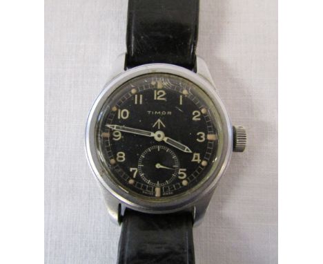 Timor - World War II British Military Issue 'Dirty Dozen' wristwatch with black leather strap, rear of case marked 'WWW K 776