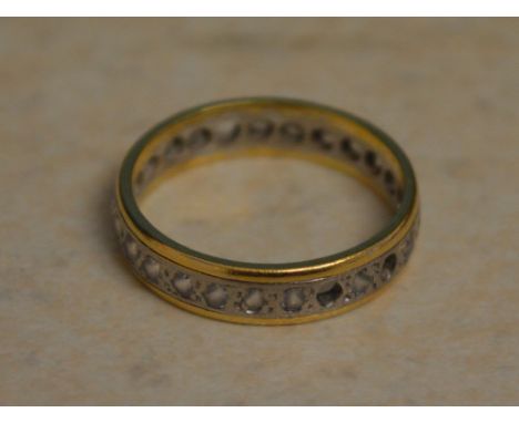 Yellow metal (possibly 18ct - hallmarks unreadable) eternity ring with some stones missing, total approx weight 3.80g, Ring S