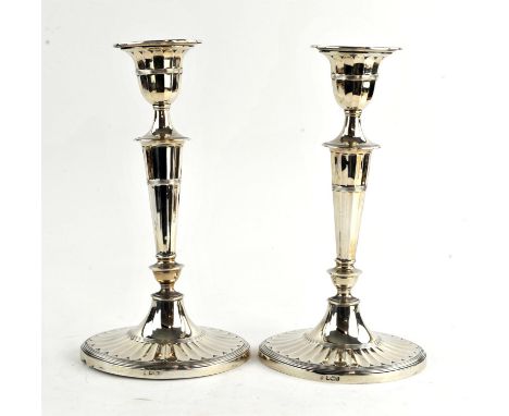 Pair of late Victorian fluted oval tapering silver presentation candlesticks by Hawksworth, Eyre & Co Ltd, Sheffield 1897 H28