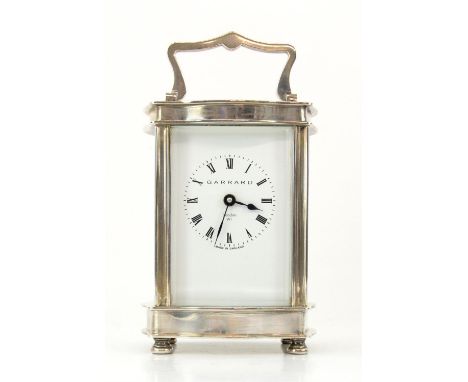 Modern silver Garrard & Co. serpentine carriage clock, with lever movement, the white enamelled dial with Roman numerals, on 
