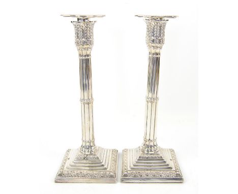 Pair of Victorian silver reeded candlesticks on stepped bases, by Martin, Hall & Co., London, 1886, filled bases, 27.5cm high