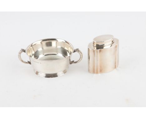 Silver two handled bowl, with stepped base, engraved initials, 16 cm wide, Birmingham 1935, and a shaped silver tea caddy, 8.