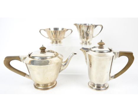 George VI silver four piece tea service, comprising teapot, hot water jug, cream jug and sugar bowl, by Goldsmiths & Silversm