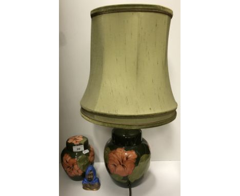A Moorcroft "Hibiscus" pattern ginger jar and cover, 15 cm high, together with a matching table lamp of ginger jar form, appr