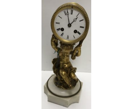 A 19th Century French gilt bronze cased drum clock, the eight day movement by Futvoye of Paris bearing Medaille D'Argent stam