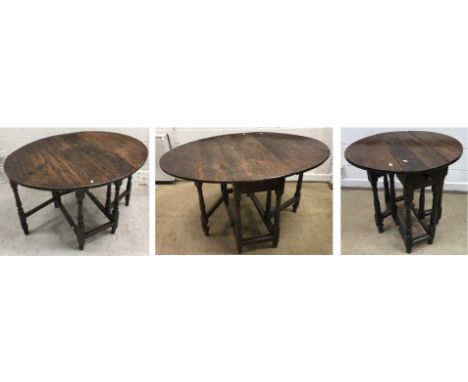 A 19th Century oak oval gate-leg drop-leaf dining table on turned supports united by stretchers, 106 cm wide x 85 cm deep x 7
