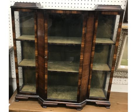 A miniature mahogany table-top breakfront display case in the Art Deco taste, with central door enclosing a green velvet-line