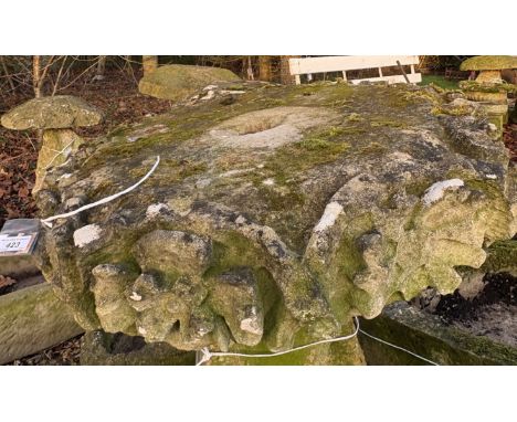 A possibly 18th Century carved natural stone platform / finial, with flower head design to the edge, approx 67 cm diameter x 