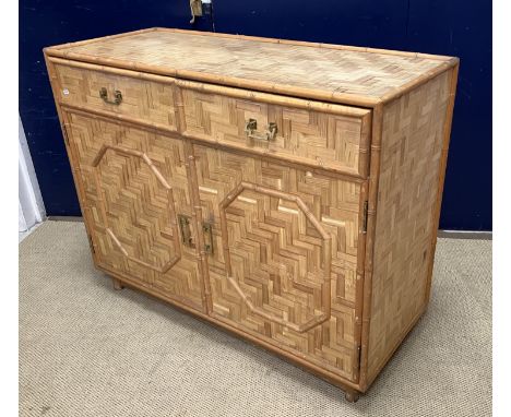 A vintage bamboo parquetry work veneered side cabinet, within a faux bamboo framework, with two drawers over two cupboard doo