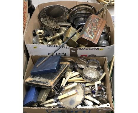A collection of various metal wares to include various bone and ivorine handled cutlery, brass candlesticks, plated candlesti