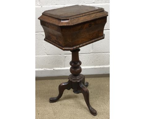 A Victorian burr walnut teapoy of ogee form, the top opening to reveal a vacant interior, on a turned pedestal to cabriole tr