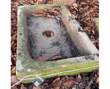 A natural stone trough of shallow rectangular form, approx 84 cm wide x 51 cm deep x 14 cm high