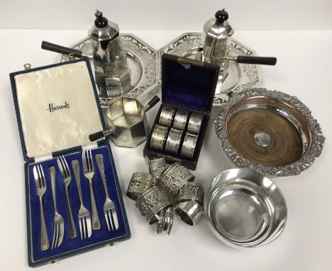 A box of various plated wares to include two octagonal pierced dishes, a set of cake forks, tumbler cup style bowl, foliate d