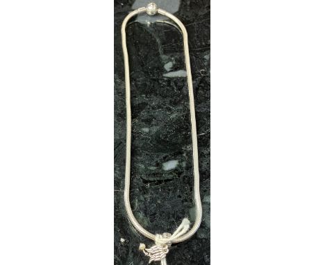 A silver chainlink bracelet with five silver or white metal charms and a silver watch chain with T bar, 2 oz over all, a silv