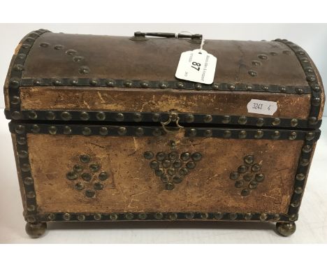 A 19th Century brass studded leather dome top trunk of small proportions with brass swing handle, opening to reveal a green v