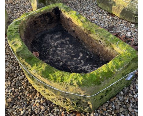 A natural stone D end trough, approx 95 cm wide x 61 cm deep x 35 cm high