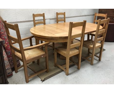 A modern oak D end pedestal extending dining table by The Cotswold Company on quadruped base with two leaves, extended 210 cm