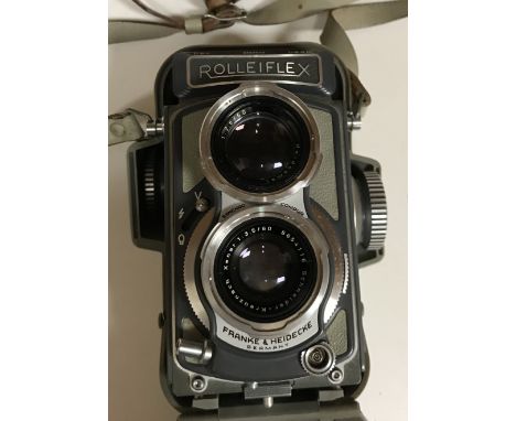 A Rolleiflex Baby Grey TLR camera by Franke & Heidecke, with synchro Compur twin lens, Serial No. 2051933, in grey leather ca