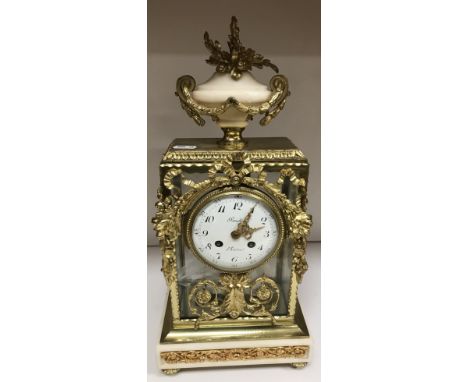 A 19th Century Napoleon III French brass and alabaster cased mantel clock, the eight day movement by Brulfer of Paris, 44 cm 