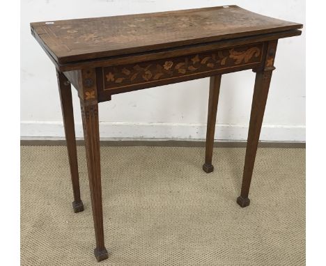 A 19th Century Dutch mahogany and marquetry inlaid card table, the rectangular fold over top decorated with birds amongst flo