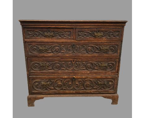 CHEST OF DRAWERS - period oak with carved front with three long and two short drawers on bracket feet, 98cms H, 107cms W, 53c