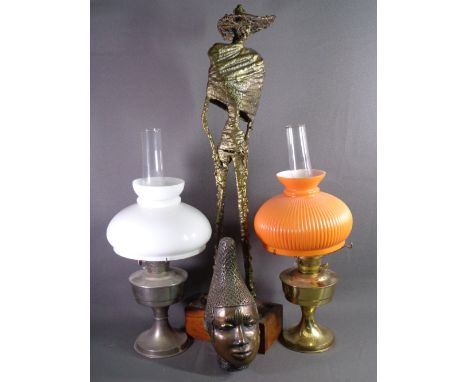 VINTAGE OIL LAMPS (2), abstract composite tall figure on a wooden plinth and a native bust