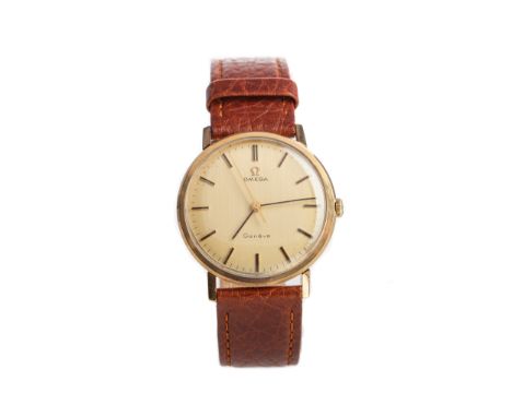 the round champagne dial with baton hour markers, outer seconds track in black, 34mm case, on a brown leather strap, lacking 