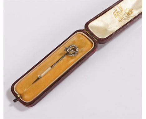 Silver equestrian interest stick pin, with a horse shoe and riding crop to the top, housed with a leather clad stick pin box 